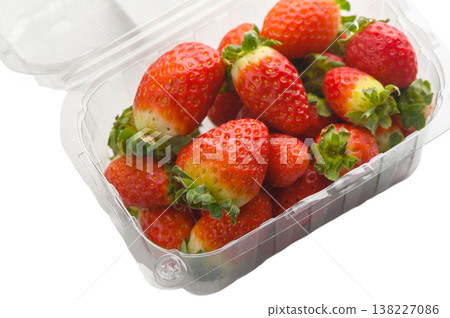 Fresh strawberries in plastic container isolated on white Fresh strawberries in plastic container isolated on white 138227086
