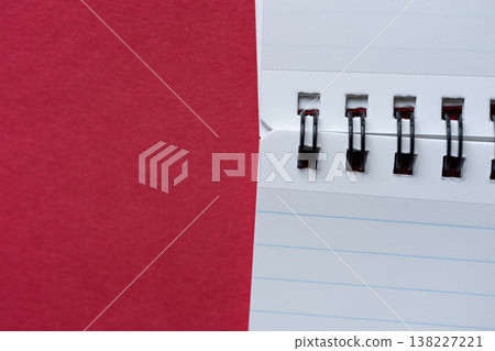 Blank notebook on a red background 138227221