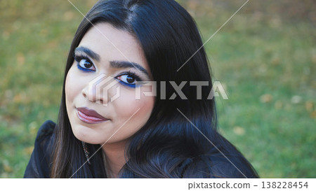 Young Bangladeshi woman in Moscow wearing vibrant blue eyeliner looking at camera Young Bangladeshi woman in Moscow wearing vibrant blue eyeliner looking at camera 138228454