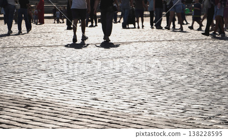 Tourists walking on cobblestones in Red Square, Moscow, exploring city life Tourists walking on cobblestones in Red Square, Moscow, exploring city life 138228595