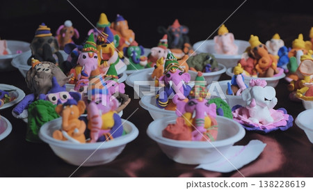 Ganesh Chaturthi celebration creating colorful handmade Ganesha idols from clay 138228619