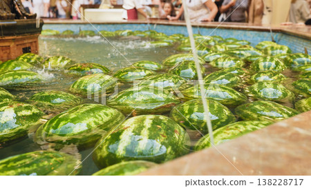 Moscow watermelons cooling in market fountain during summer Moscow watermelons cooling in market fountain during summer 138228717