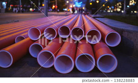 Red plastic pipes for urban infrastructure engineering construction at night 138228883