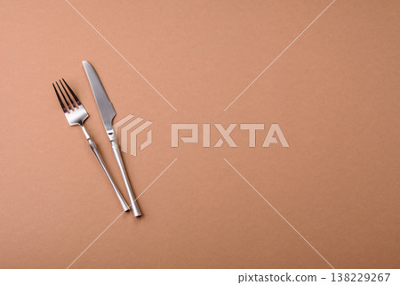 A knife and fork, silver kitchen utensils for the dining table. A knife and fork A knife and fork, silver kitchen utensils for the dining table. A knife and fork 138229267