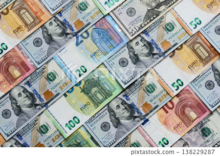 Euro and dollar banknotes, exchange, sales, economic tariffs and taxes. Euros and dollars Euro and dollar banknotes, exchange, sales, economic tariffs and taxes. Euros and dollars 138229287