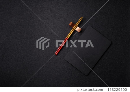 An empty slate cutting board with cutlery on a kitchen counter. Slate cutting board An empty slate cutting board with cutlery on a kitchen counter. Slate cutting board 138229300