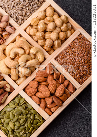 A mix of cashews, pistachios, almonds, macadamia and hazelnuts. Nuts as a food background 138229311