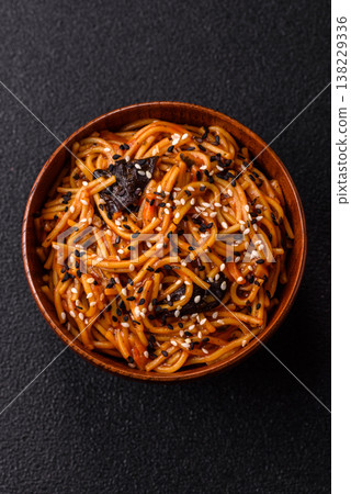 Yakisoba, Asian noodles with vegetables and meat, is a Japanese spicy food. Yakisoba or udon Yakisoba, Asian noodles with vegetables and meat, is a Japanese spicy food. Yakisoba or udon 138229336