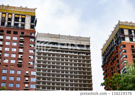 Urban development with modern buildings under construction in a developing city 138229376