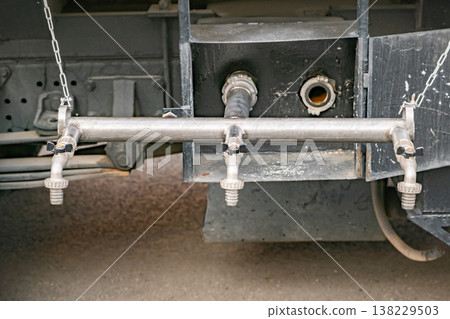 Water tank truck outlet with multiple faucets and distribution pipes Water tank truck outlet with multiple faucets and distribution pipes 138229503