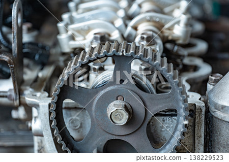 Automotive engine showing internal timing belt system, gears, and mechanical parts 138229523