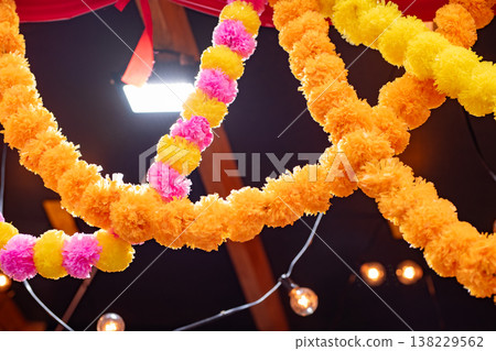 Colorful marigold garlands decorating for Indian wedding or Diwali celebration Colorful marigold garlands decorating for Indian wedding or Diwali celebration 138229562