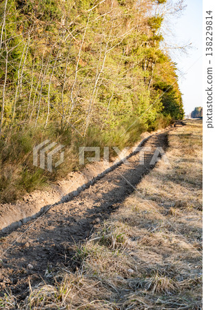 Rural firebreak creating barrier protecting forest from wildfire and bushfire spreading Rural firebreak creating barrier protecting forest from wildfire and bushfire spreading 138229814