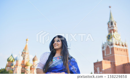Bangladeshi woman in Moscow enjoying Red Square views, wearing traditional saree Bangladeshi woman in Moscow enjoying Red Square views, wearing traditional saree 138229858