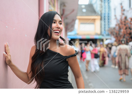 Thai Woman Tourist Smiling by Pink Wall in Phuket Old Town Thailand Thai Woman Tourist Smiling by Pink Wall in Phuket Old Town Thailand 138229959