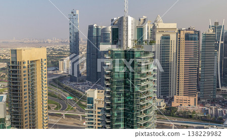 Aerial top view of Dubai Marina morning timelapse. Modern towers and traffic on the road Aerial top view of Dubai Marina morning timelapse. Modern towers and traffic on the road 138229982