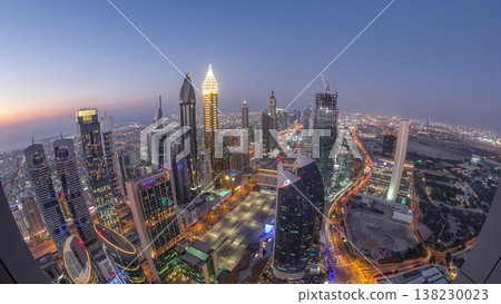 Skyline of the buildings of Sheikh Zayed Road and DIFC aerial day to night timelapse in Dubai, UAE. 138230023