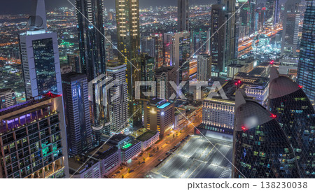 Skyline of the buildings of Sheikh Zayed Road and DIFC aerial night timelapse in Dubai, UAE. Skyline of the buildings of Sheikh Zayed Road and DIFC aerial night timelapse in Dubai, UAE. 138230038