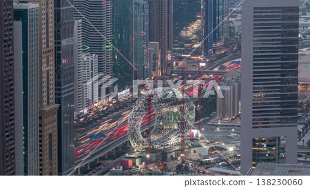 Construction site of the Museum of the Future aerial day to night timelapse, next iconic building of Dubai. Construction site of the Museum of the Future aerial day to night timelapse, next iconic building of Dubai. 138230060