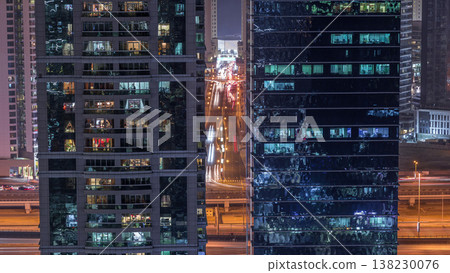 Residential and office buildings in Jumeirah lake towers district night timelapse in Dubai 138230076