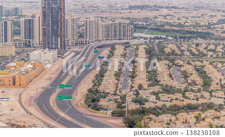 Aerial view of apartment houses and villas in Dubai city timelapse, United Arab Emirates Aerial view of apartment houses and villas in Dubai city timelapse, United Arab Emirates 138230108