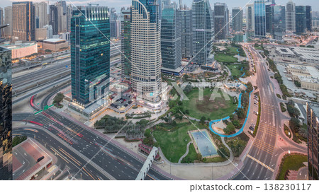 Jumeirah Lake Towers residential district aerial day to night timelapse near Dubai Marina Jumeirah Lake Towers residential district aerial day to night timelapse near Dubai Marina 138230117