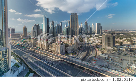 Skyline view of the buildings of Sheikh Zayed Road and DIFC timelapse in Dubai, UAE. 138230119