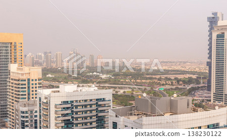 Dubai Golf Course with a cityscape of Greens and tecom districts at the background aerial timelapse 138230122