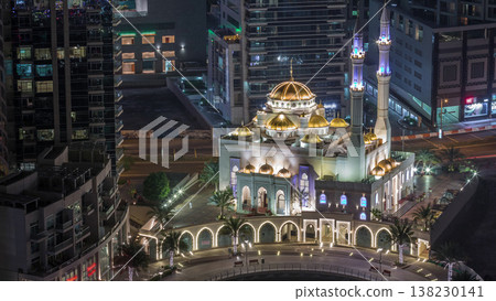 Modern residential architecture of Dubai Marina and Mohammed Bin Ahmed Almulla Mosque aerial night timelapse Modern residential architecture of Dubai Marina and Mohammed Bin Ahmed Almulla Mosque aerial night timelapse 138230141