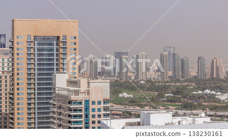 Dubai Golf Course with a cityscape of Greens and tecom districts at the background aerial timelapse 138230161