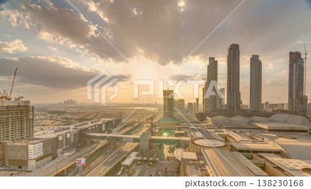 Sunrise aerial view of Financial center road morning timelapse with under construction building Sunrise aerial view of Financial center road morning timelapse with under construction building 138230168
