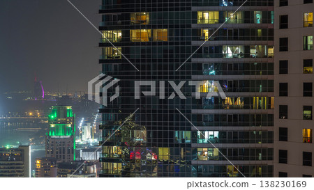 Modern skyscrapers in Jumeirah beach residence in Dubai, JBR aerial night timelapse Modern skyscrapers in Jumeirah beach residence in Dubai, JBR aerial night timelapse 138230169