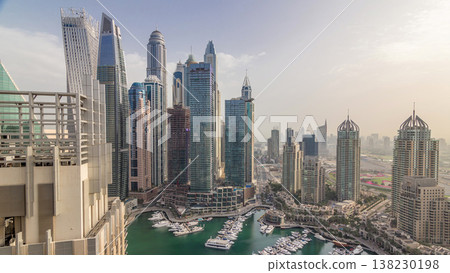 Aerial top view of Dubai Marina morning timelapse. Modern towers and traffic on the road Aerial top view of Dubai Marina morning timelapse. Modern towers and traffic on the road 138230198