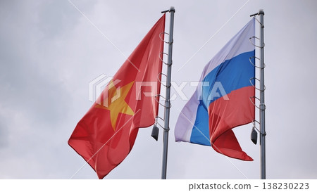 National flags of Vietnam and Russia waving together on flagpoles National flags of Vietnam and Russia waving together on flagpoles 138230223