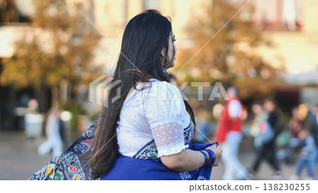 Bangladeshi woman wearing a traditional saree exploring Moscow city street Bangladeshi woman wearing a traditional saree exploring Moscow city street 138230255