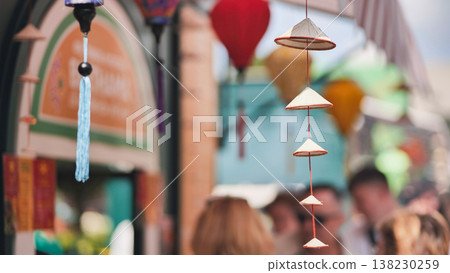 Traditional vietnamese conical hats hanging in a souvenir shop in Vietnam Traditional vietnamese conical hats hanging in a souvenir shop in Vietnam 138230259
