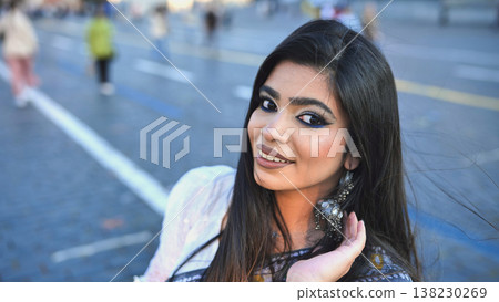 Bangladeshi woman looking at camera, smiling in Moscow street with stunning makeup Bangladeshi woman looking at camera, smiling in Moscow street with stunning makeup 138230269