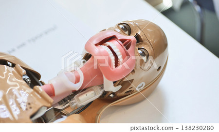 Medical training mannequin featuring open mouth for intubation simulation 138230280