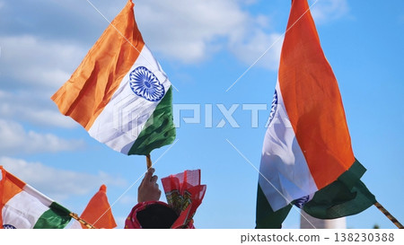 Indian flags waving against a blue sky during India Day celebrations in Moscow 138230388