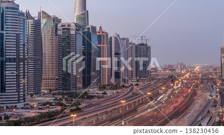 Aerial top view to Sheikh Zayed road near Dubai Marina and JLT night to day timelapse, Dubai. Aerial top view to Sheikh Zayed road near Dubai Marina and JLT night to day timelapse, Dubai. 138230456