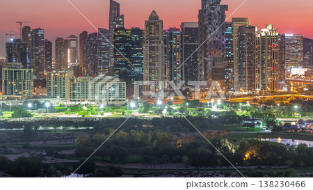 Jumeirah lake towers skyscrapers and golf course day to night timelapse, Dubai, United Arab Emirates Jumeirah lake towers skyscrapers and golf course day to night timelapse, Dubai, United Arab Emirates 138230466