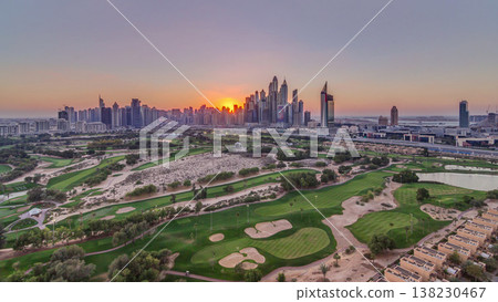 Dubai Marina skyscrapers and golf course sunset timelapse, Dubai, United Arab Emirates Dubai Marina skyscrapers and golf course sunset timelapse, Dubai, United Arab Emirates 138230467