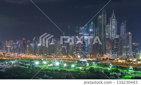 Dubai Marina skyscrapers and golf course night timelapse, Dubai, United Arab Emirates Dubai Marina skyscrapers and golf course night timelapse, Dubai, United Arab Emirates 138230483