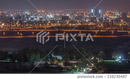 Aerial view to villas and houses near Golf course night timelapse Aerial view to villas and houses near Golf course night timelapse 138230487