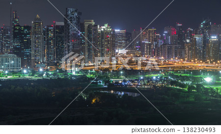 Jumeirah lake towers and Dubai marina skyscrapers and golf course night timelapse, Dubai, United Arab Emirates Jumeirah lake towers and Dubai marina skyscrapers and golf course night timelapse, Dubai, United Arab Emirates 138230493