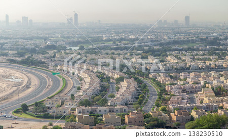 Aerial view to villas and houses with Golf course with green lawn and lakes timelapse Aerial view to villas and houses with Golf course with green lawn and lakes timelapse 138230510