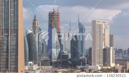 Skyline view of the buildings of Sheikh Zayed Road and DIFC timelapse in Dubai, UAE. Skyline view of the buildings of Sheikh Zayed Road and DIFC timelapse in Dubai, UAE. 138230521