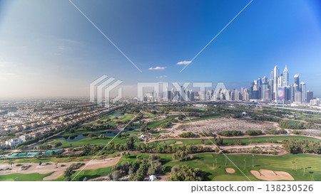 Dubai Marina skyscrapers and golf course morning timelapse, Dubai, United Arab Emirates Dubai Marina skyscrapers and golf course morning timelapse, Dubai, United Arab Emirates 138230526