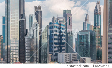 Aerial view on downtown and financial district in Dubai timelapse, United Arab Emirates with skyscrapers and highways. 138230534
