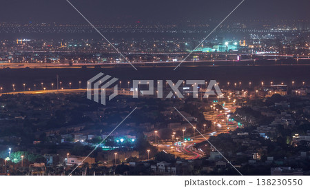 Aerial view of apartment houses and villas in Dubai city night timelapse, United Arab Emirates Aerial view of apartment houses and villas in Dubai city night timelapse, United Arab Emirates 138230550